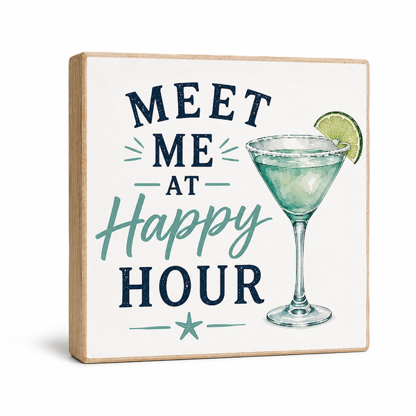 A square decorative wooden sign with a light natural wood border and an off-white face, featuring the phrase 'MEET ME AT Happy HOUR' in navy and teal lettering alongside an illustration of a martini glass with a lime wedge. The sign is photographed on a clean white background with a soft shadow.