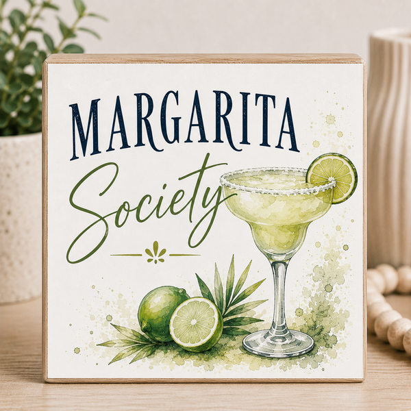 Decorative sign with 'Margarita Society' text and a margarita illustration on a wooden surface.
