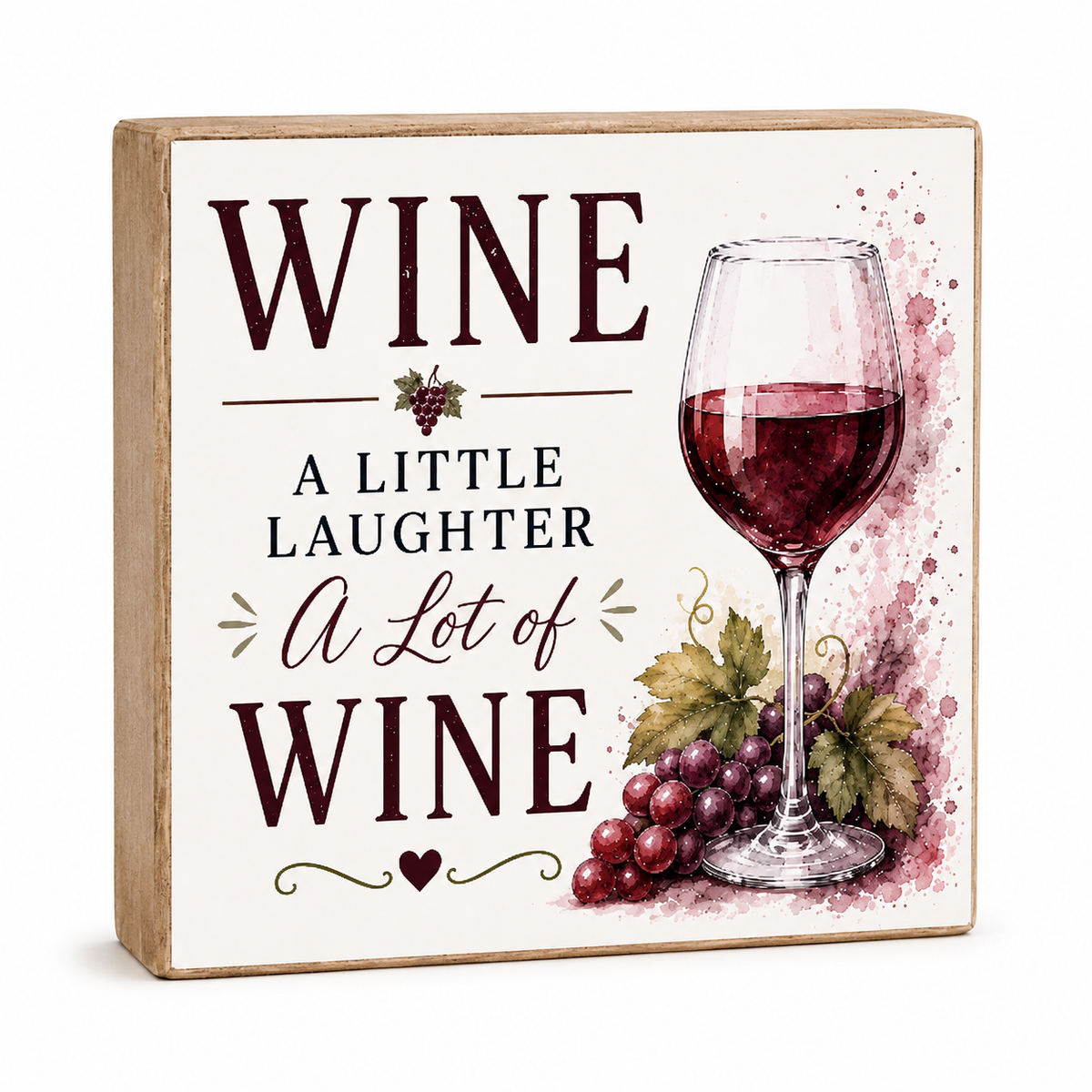 A square decorative wooden sign with a light natural wood border and a cream face. The sign features the text 'WINE A LITTLE LAUGHTER A Lot of WINE' in dark burgundy and black lettering, accompanied by a watercolor illustration of a glass of red wine and purple grapes.