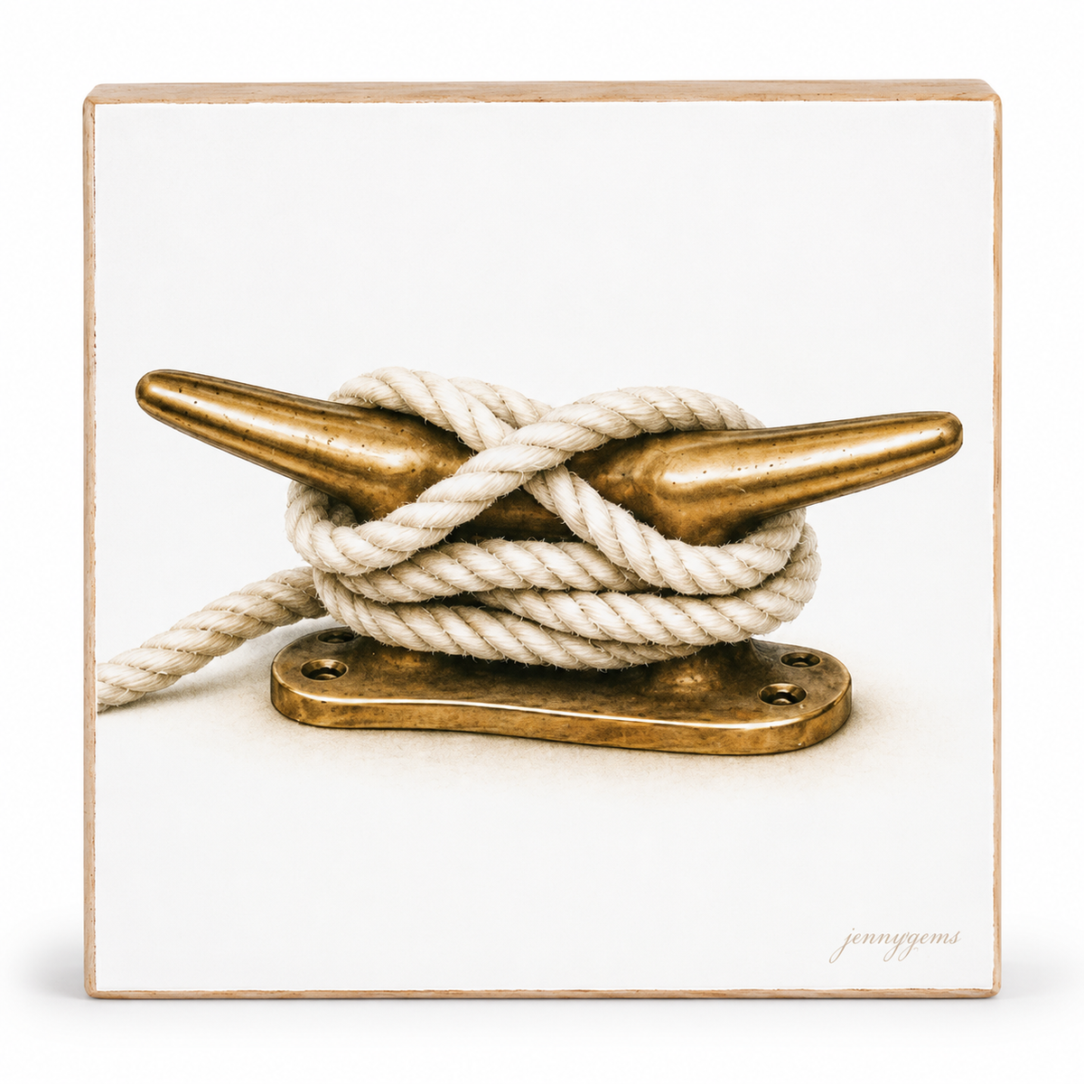 Square wall art print featuring a nautical photograph of a white rope tied around a brass anchor cleat, with a light wood border and a small artist signature in the lower right corner.