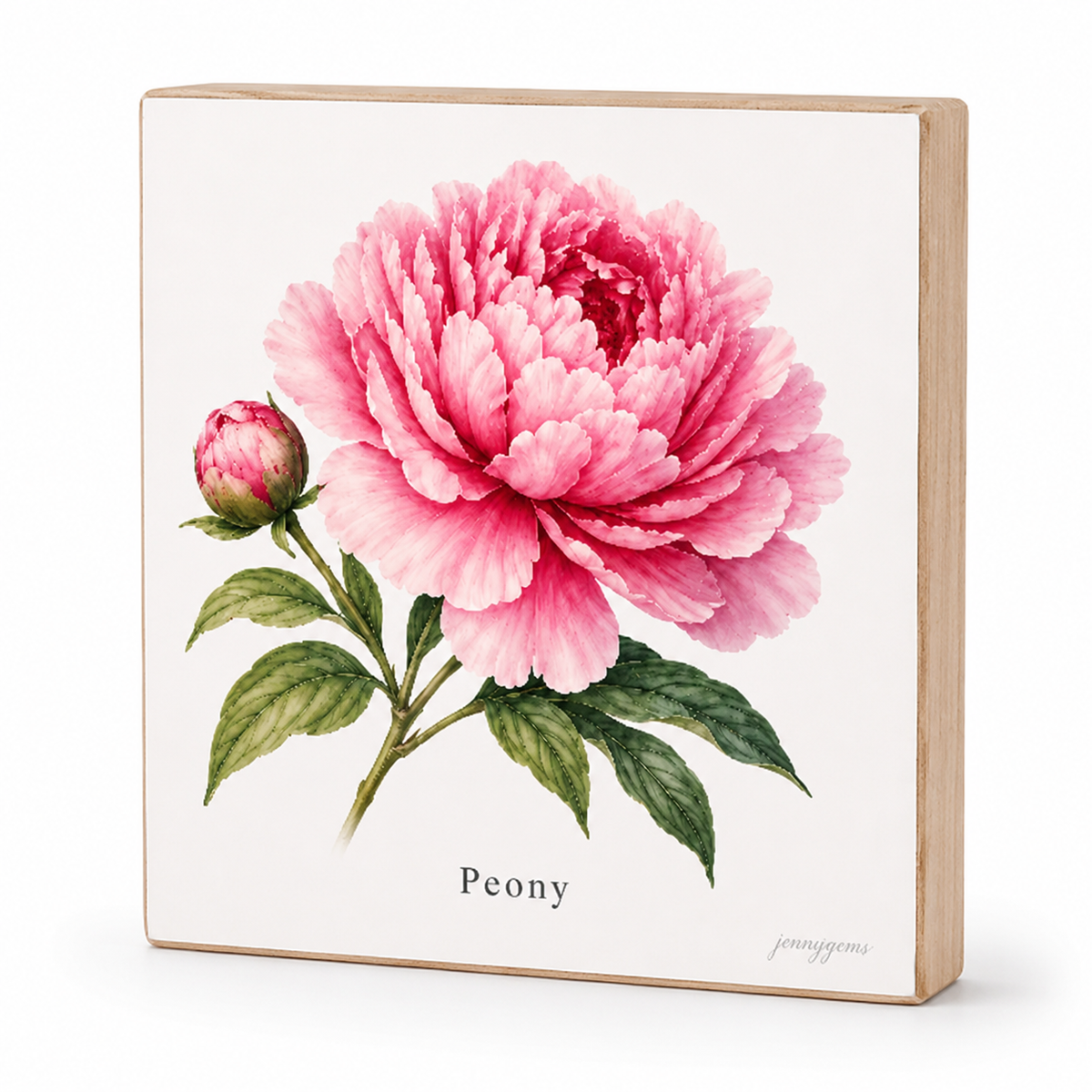 A square wooden block sign featuring a botanical illustration of a pink peony flower with green leaves on an off-white background, with the word 'Peony' printed below and a small 'jennyjeps' signature in the lower right corner.