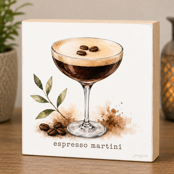 Decorative sign with an illustration of an espresso martini and coffee beans on a wooden surface.