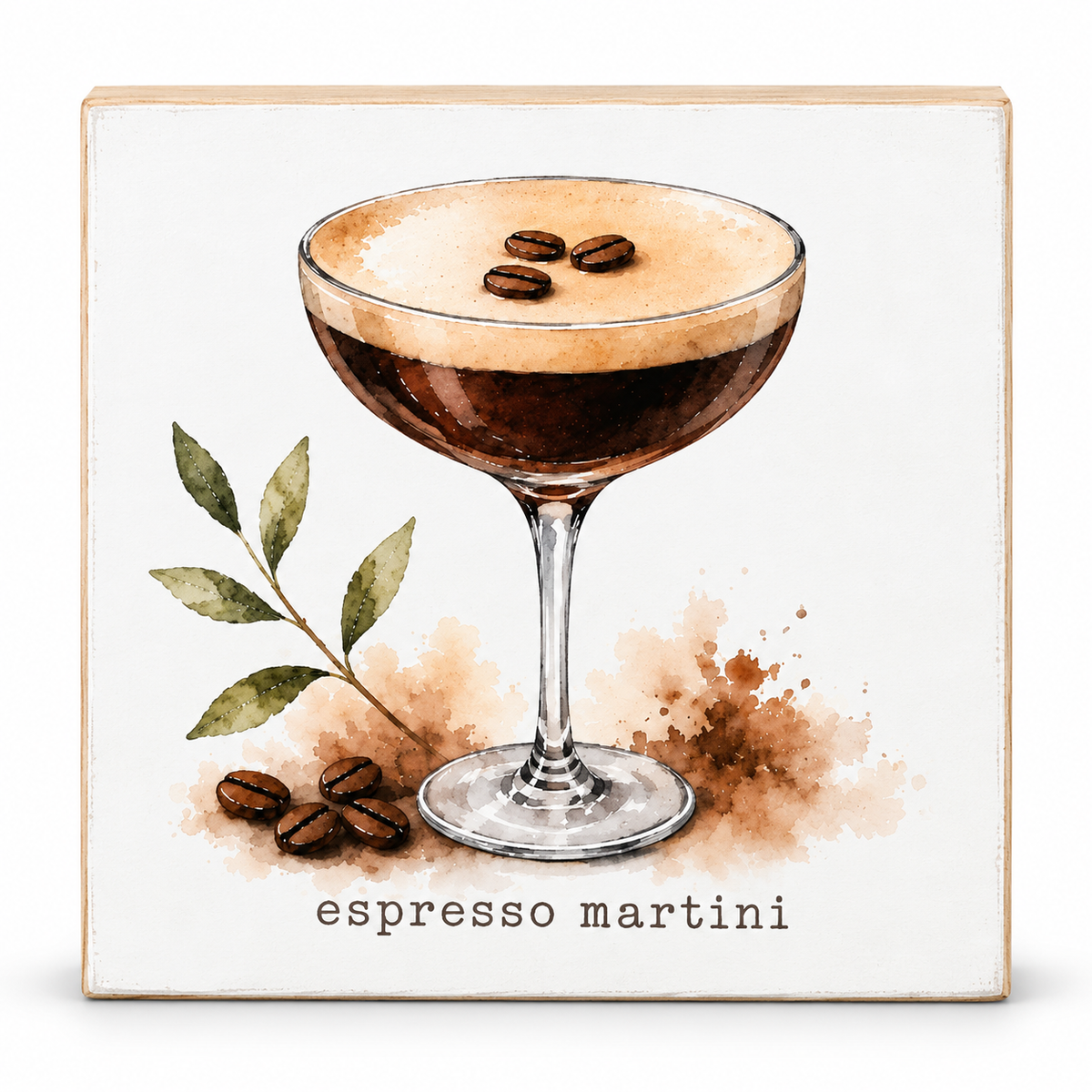 A square decorative wall sign featuring a watercolor-style illustration of an espresso martini in a coupe glass, with coffee beans, leaves, and the text 'espresso martini' on a white background with a light wood border.