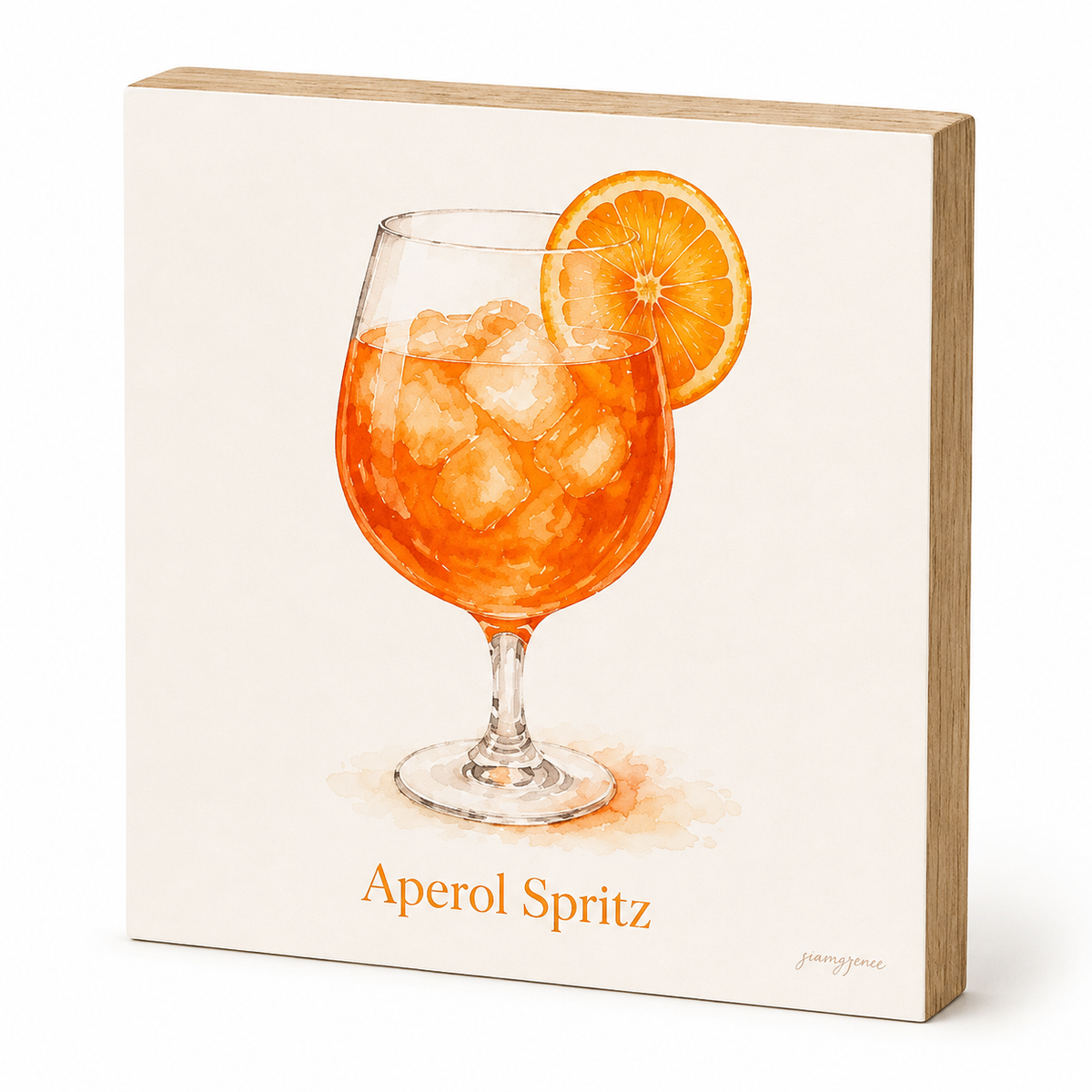 A square decorative wall sign with a light wood border and a printed illustration of an orange Aperol Spritz cocktail in a glass with an orange slice garnish. The words 'Aperol Spritz' appear below the illustration, and a small artist signature is visible in the lower right corner.