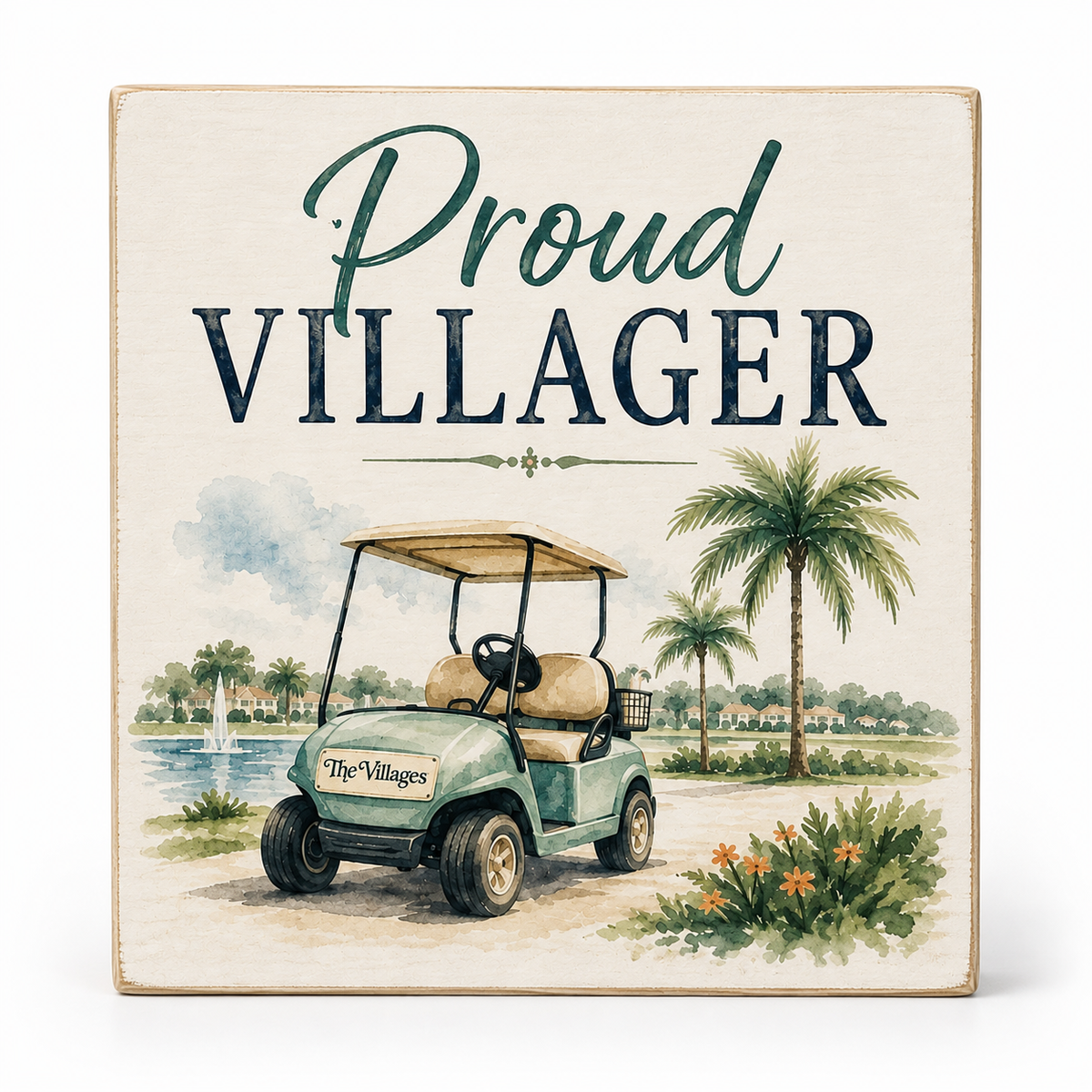 A square decorative sign with a rustic wood-look border featuring the text 'Proud VILLAGER' above an illustrated golf cart, palm trees, water, and flowers on a light background.