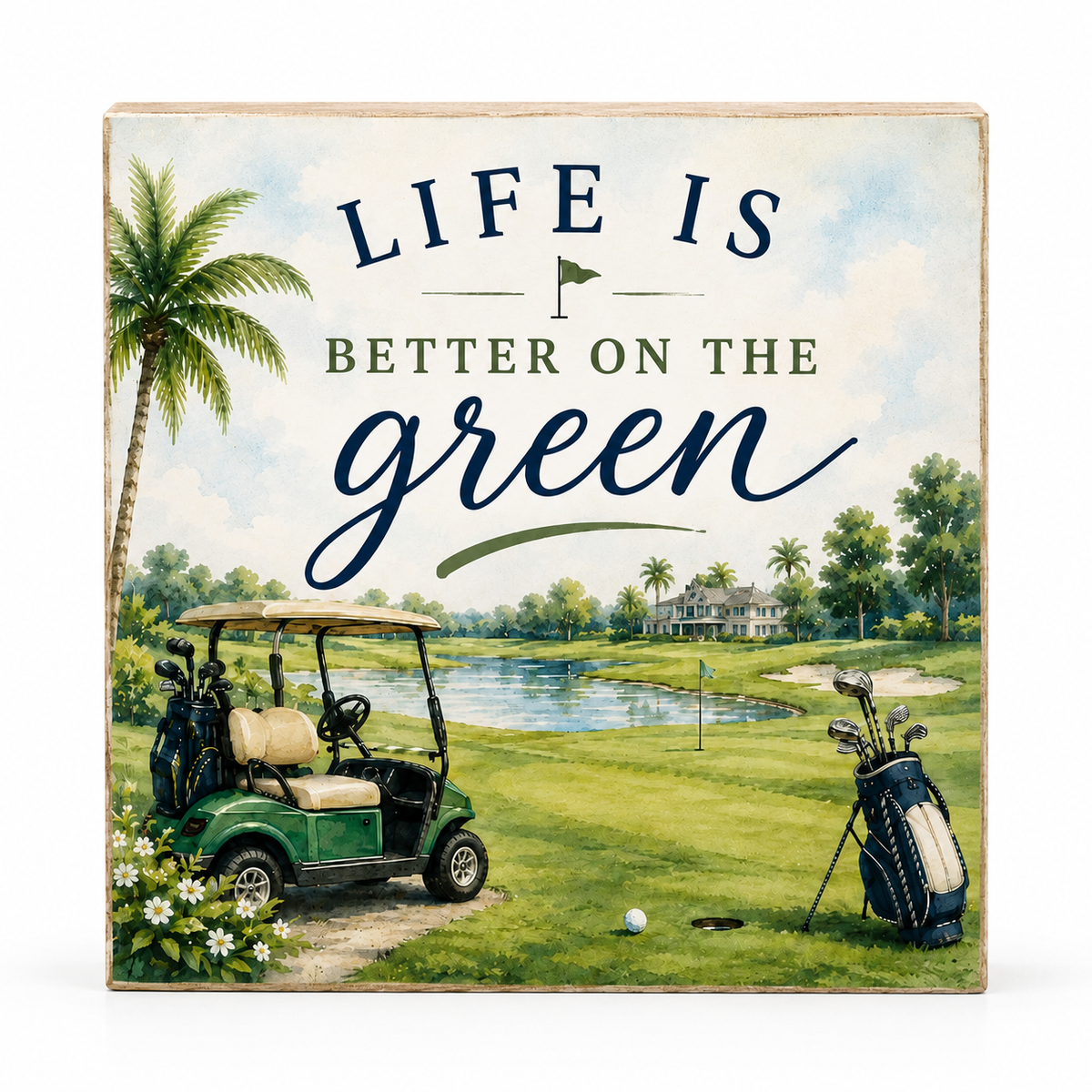 Square decorative wall sign with a golf course scene and the phrase “LIFE IS BETTER ON THE green” in lettering, shown against a plain white background.