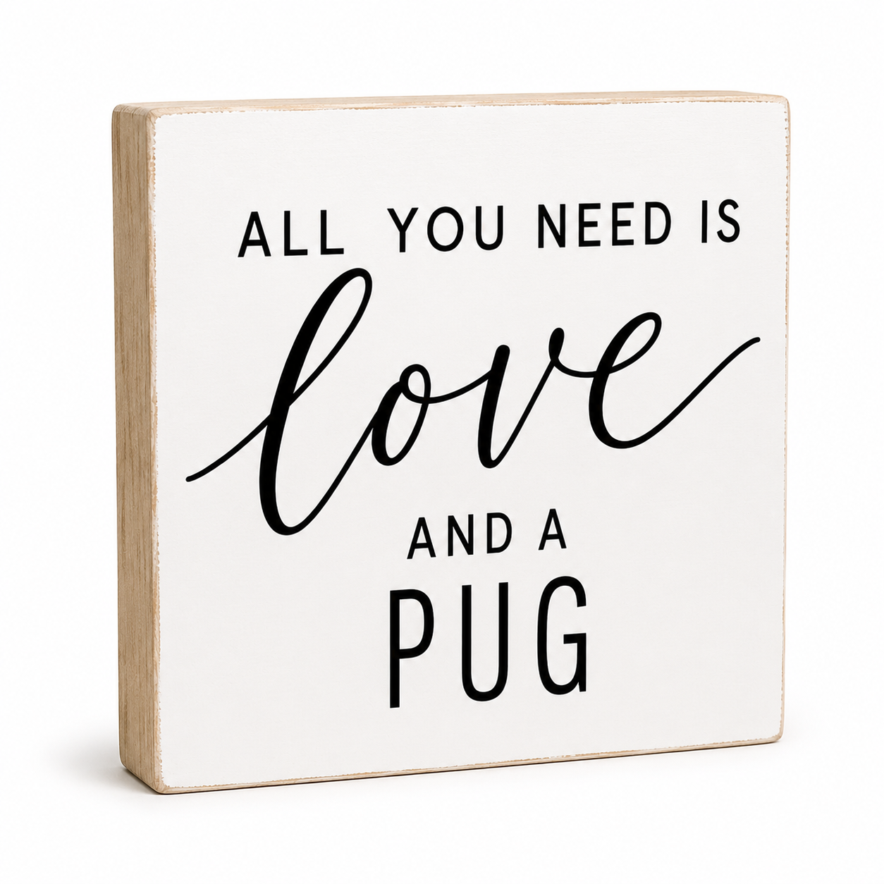 A square decorative wooden sign with a white face and natural wood edges, printed with the phrase 'ALL YOU NEED IS love AND A PUG' in black lettering, shown on a clean white background.
