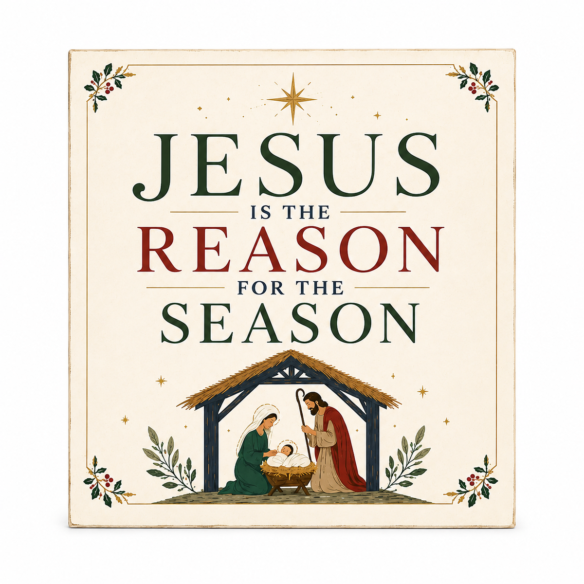 A square decorative sign with the phrase “JESUS IS THE REASON FOR THE SEASON” in large dark green and red lettering on a warm cream background. The bottom features a small nativity scene with Mary, Joseph, baby Jesus, and a stable.