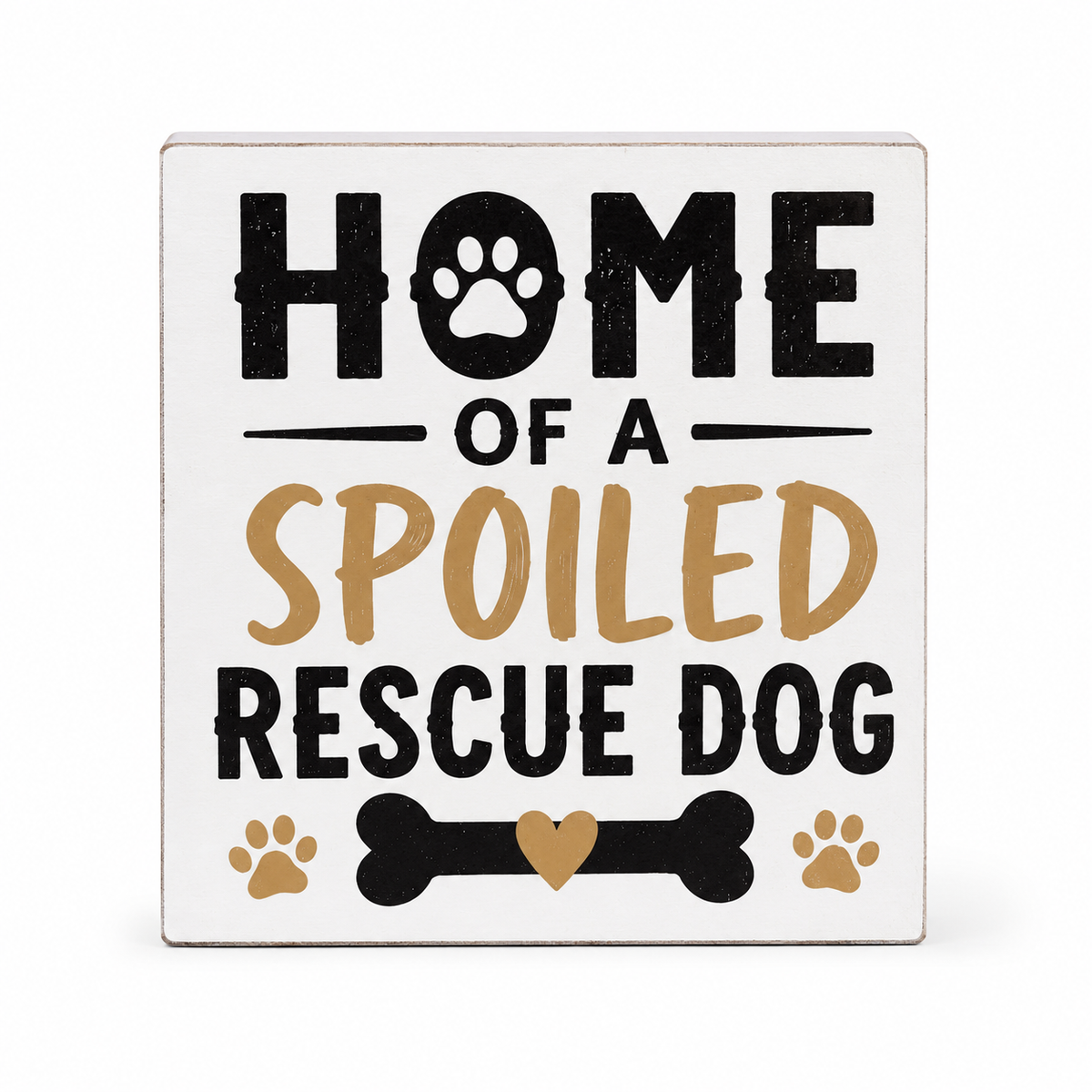 A square white decorative sign with the phrase 'HOME OF A SPOILED RESCUE DOG' in black and tan lettering, plus small dog paw and bone graphics, shown on a light gray background.