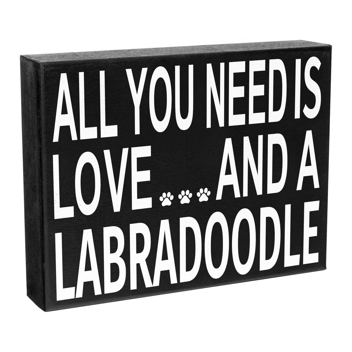 A black wooden sign with the text 'All you need is LOVE and a LABRADOODLE' printed in white.