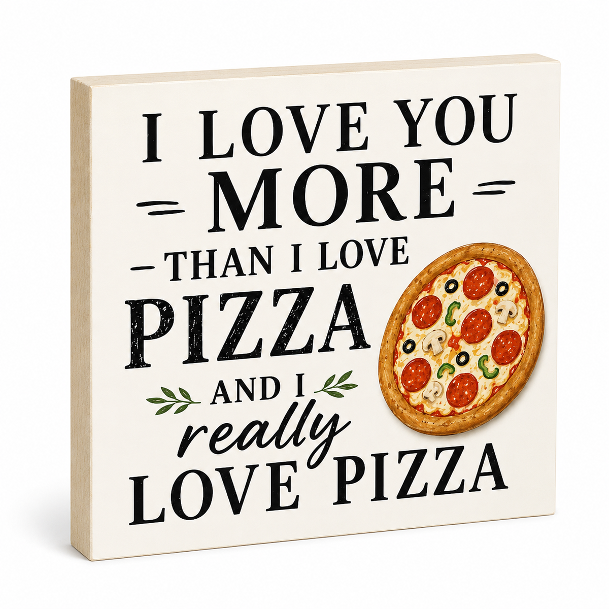 A square decorative sign with a light beige wood-toned edge and a cream face, printed with the phrase “I LOVE YOU MORE THAN I LOVE PIZZA AND I really LOVE PIZZA” in black lettering, plus a printed pizza illustration. No person, animal, or real environment is present, so this is Product/Packaging.