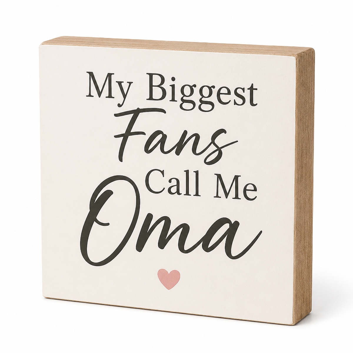 A square decorative wooden sign with a cream face and natural wood edges, printed with the phrase 'My Biggest Fans Call Me Oma' in black lettering and a small pink heart at the bottom, shown on a white background.