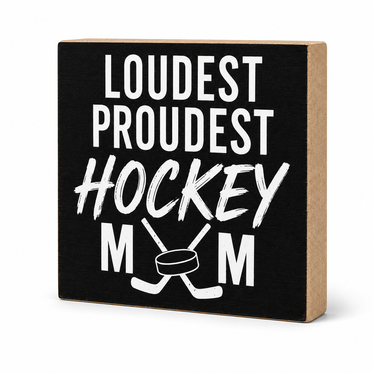 A square decorative block sign with a black front and natural wood sides, printed with the phrase 'LOUDEST PROUDEST HOCKEY MOM' in white lettering with crossed hockey sticks and a hockey puck graphic.