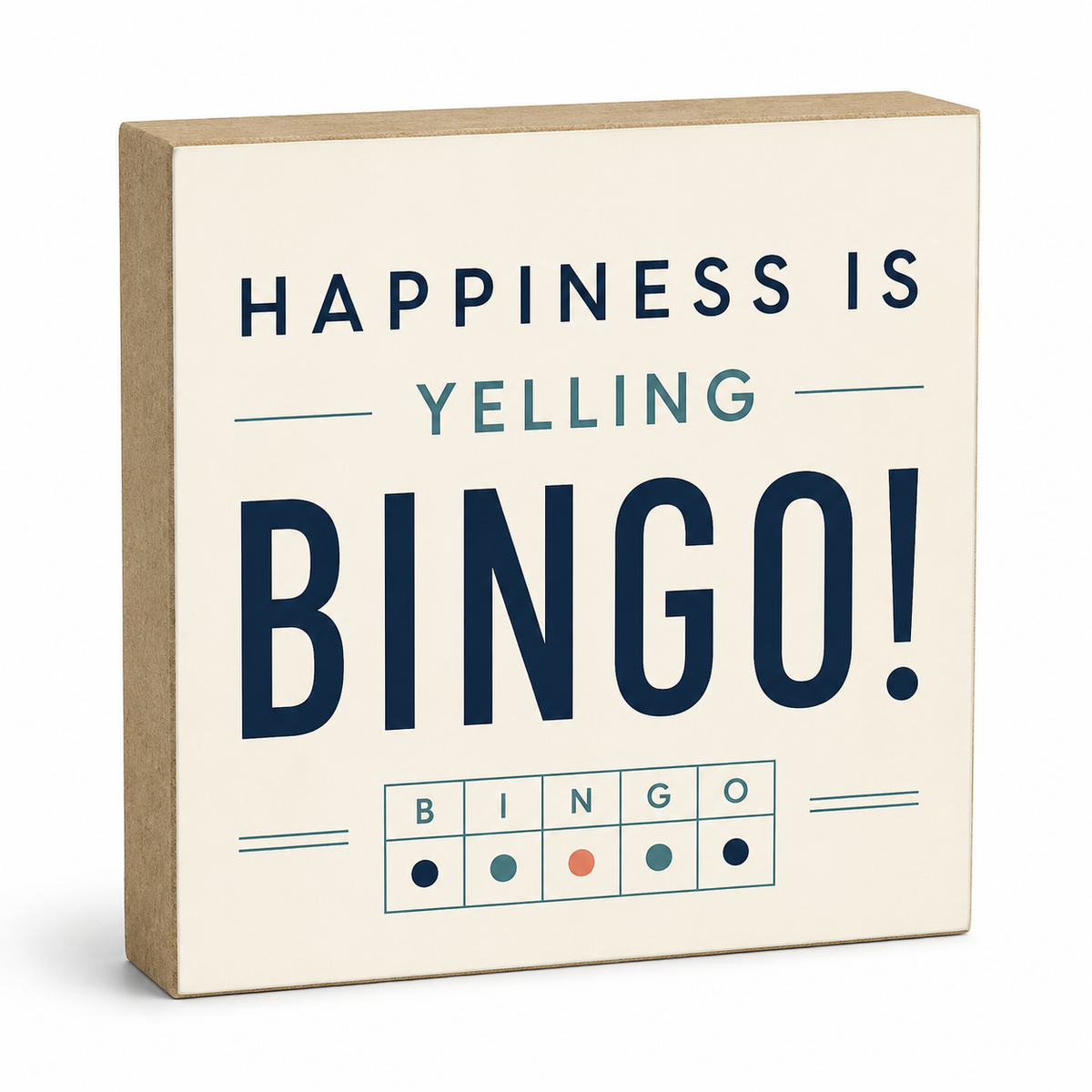 A square decorative sign with a kraft-paper side edge and a cream face printed with the phrase “HAPPINESS IS YELLING BINGO!” in navy and muted blue lettering, plus a small bingo grid at the bottom.