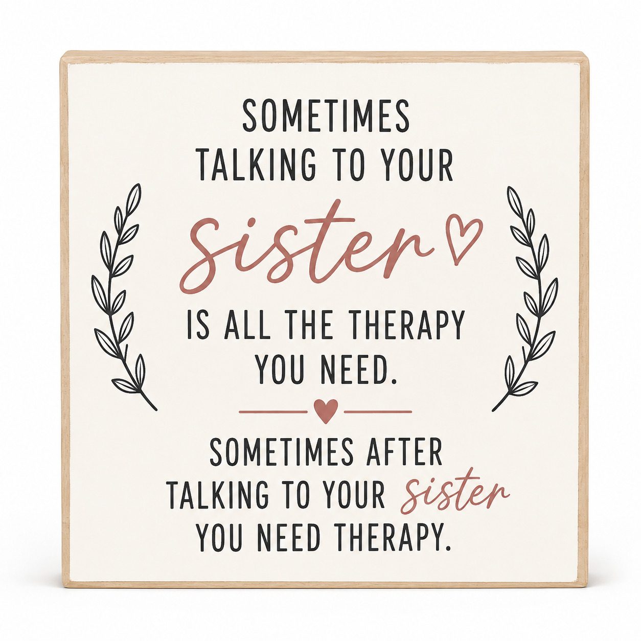 A square decorative sign with a light wood border and cream background, featuring the text 'Sometimes talking to your sister is all the therapy you need.' and 'Sometimes after talking to your sister you need therapy.