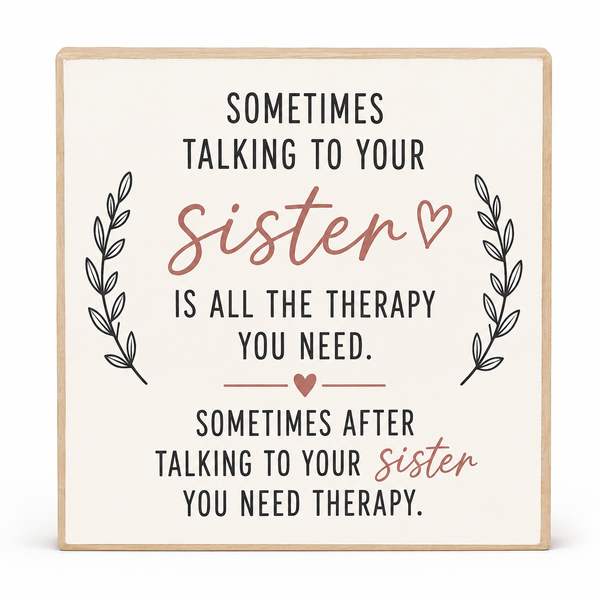 A square decorative sign with a light wood border and cream background, featuring the text 'Sometimes talking to your sister is all the therapy you need.' and 'Sometimes after talking to your sister you need therapy.