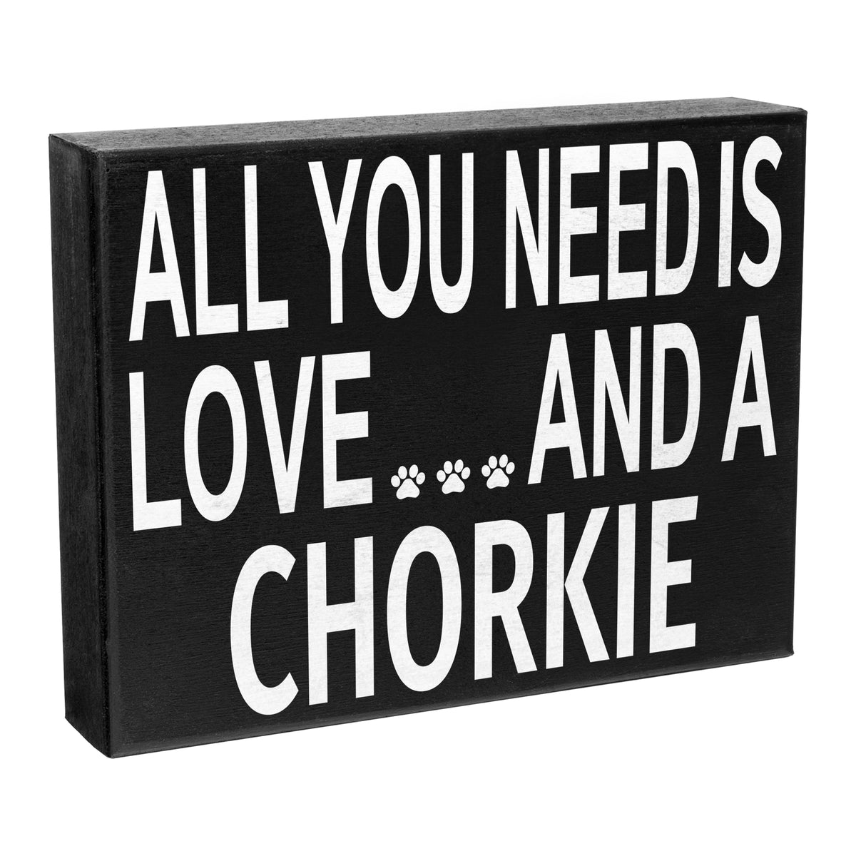 A wooden sign with the text 'All You Need Is Love and a Chorkie' printed in black, with a paw print symbol replacing the word 'Chorkie'. The sign has a black frame and a sturdy wooden construction.
