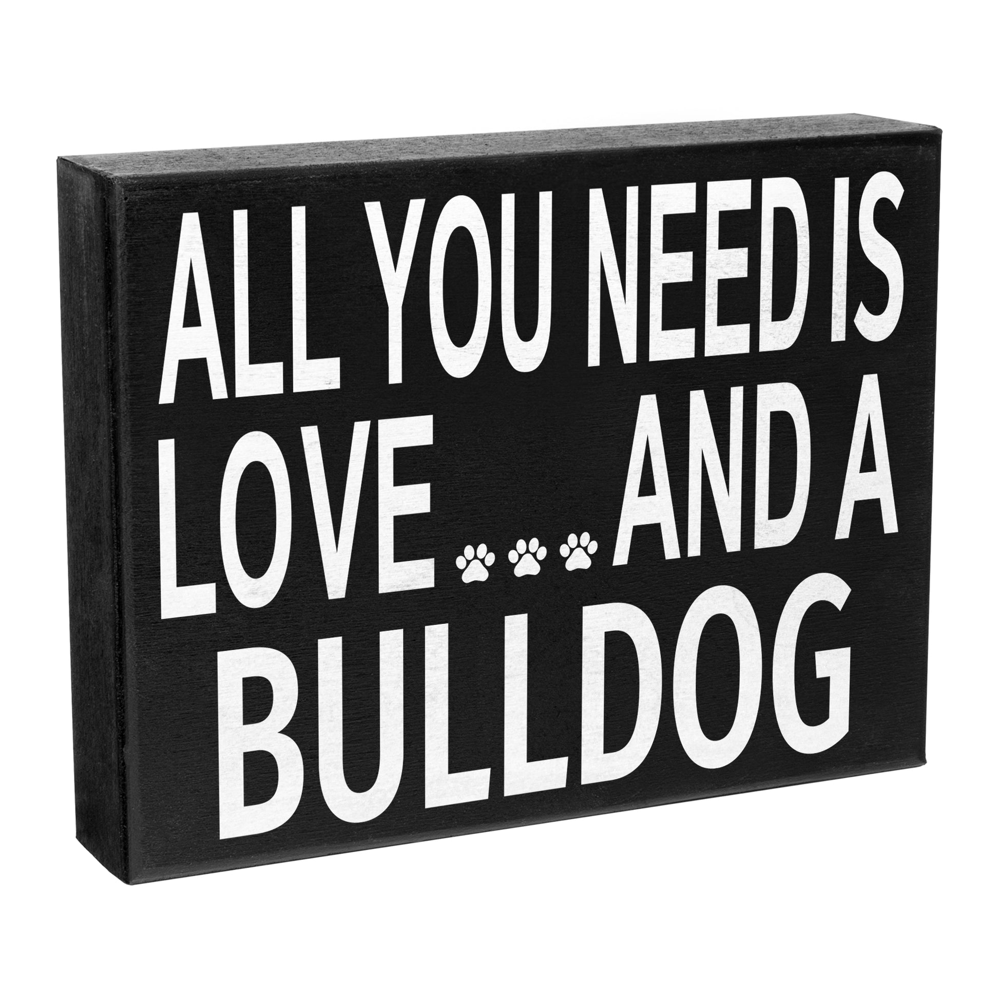 A black wooden box sign with the text 'All You Need is Love and a Bulldog' and a silhouette of a bulldog's paw prints.