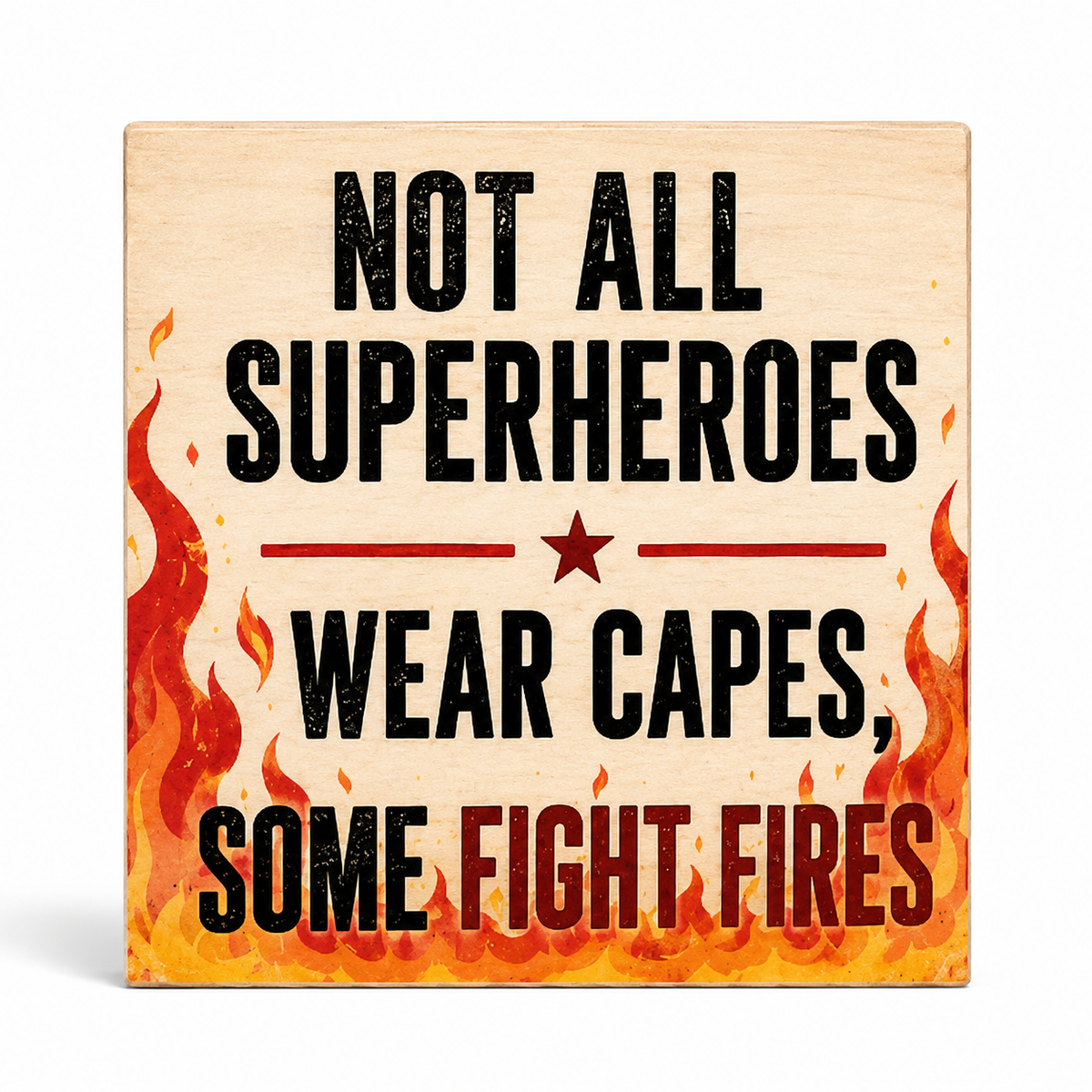 A square wooden sign with a light natural wood background, featuring the printed text 'NOT ALL SUPERHEROES WEAR CAPES, SOME FIGHT FIRES' in black and red lettering, with red and orange flames illustrated along the bottom and left edges.