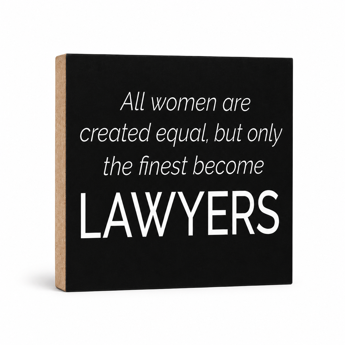 A square black decorative sign with a natural wood side edge, featuring the white text quote: 'All women are created equal, but only the finest become LAWYERS' on a clean white background.