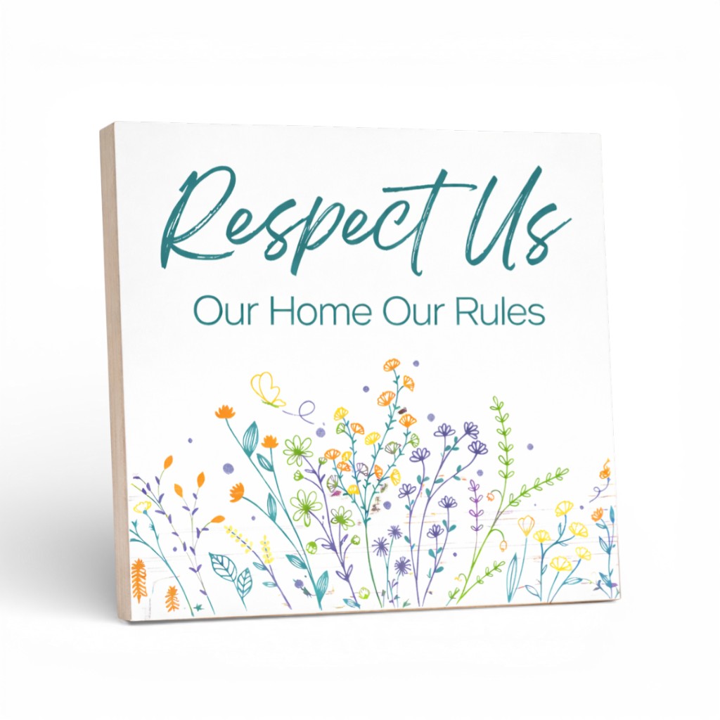 Decorative sign with floral design and text on a white background