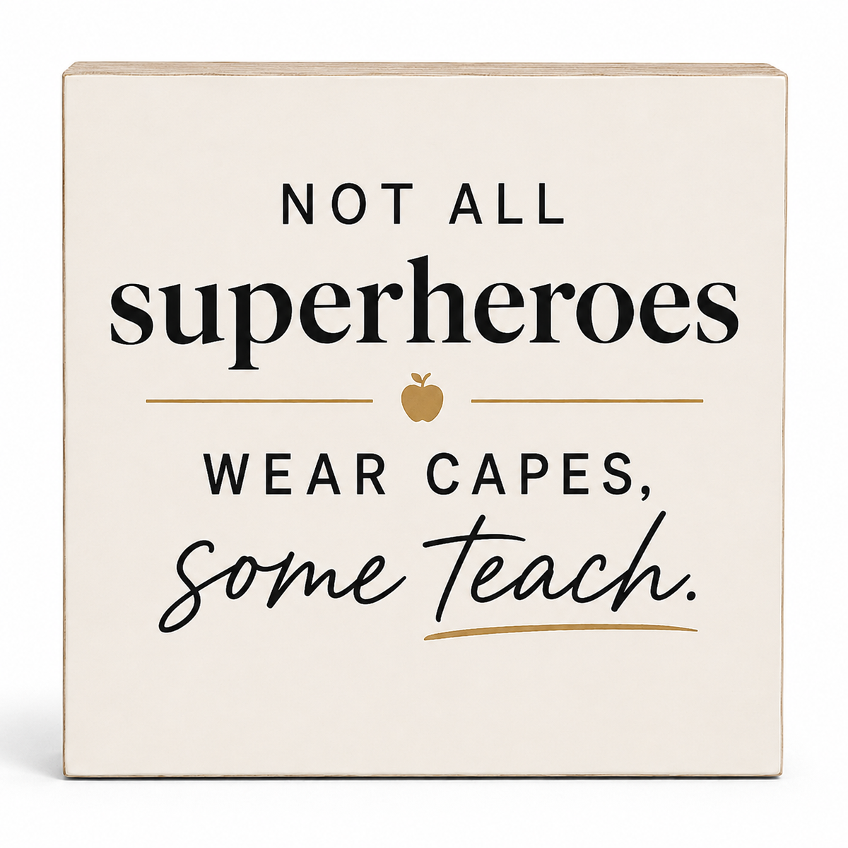 A square cream-colored wooden sign with a printed quote that reads 'NOT ALL superheroes WEAR CAPES, some teach.' in black text with a small gold apple and gold underline accents, shown on a clean white background.