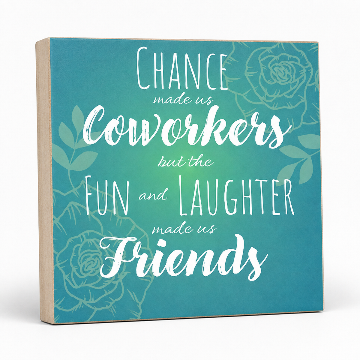 A square decorative sign with a teal-to-blue gradient background, white script text reading 'Chance made us coworkers but the fun and laughter made us friends,' and faint floral line art. The sign has a light wood side edge and is photographed on a clean white background.