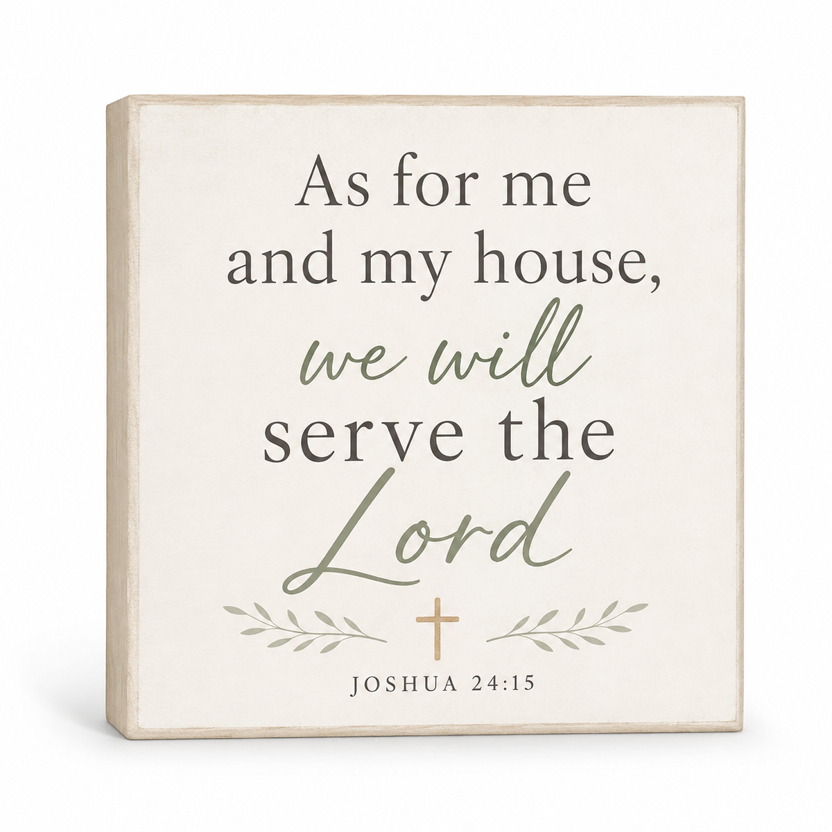 A square decorative wall sign with a distressed cream background and natural wood edges. The sign features the Bible verse 'As for me and my house, we will serve the Lord Joshua 24:15' in dark gray and sage green lettering, with a small gold cross and leafy accents.
