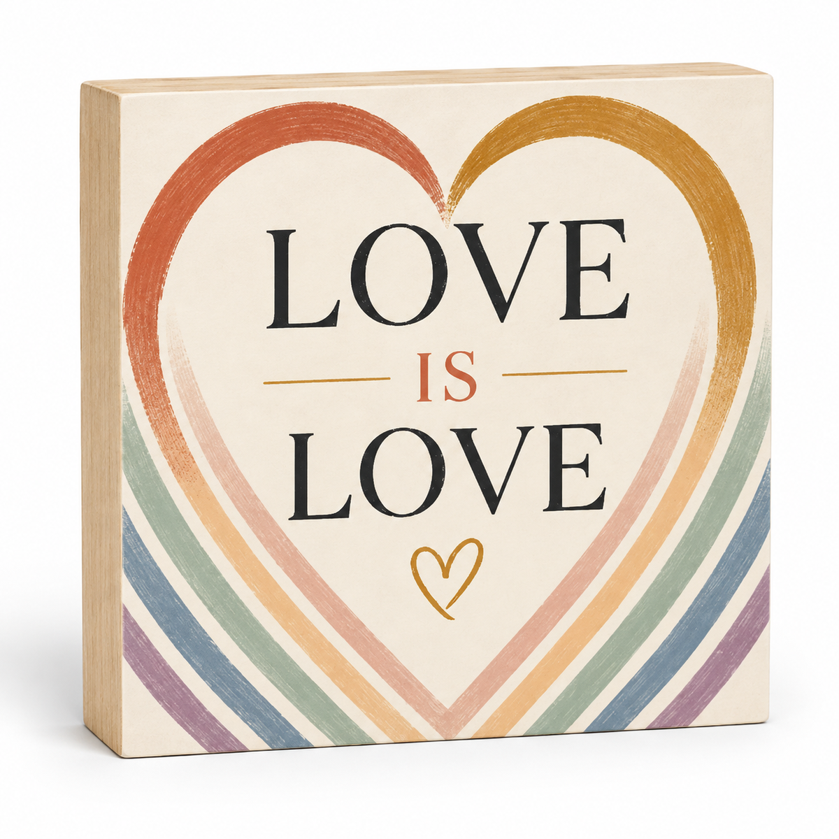 A square decorative wooden block sign with a light natural wood border and a cream face. The front features a large hand-painted style heart in warm tones with the words 'LOVE IS LOVE' in black serif lettering, plus a small gold heart at the bottom.