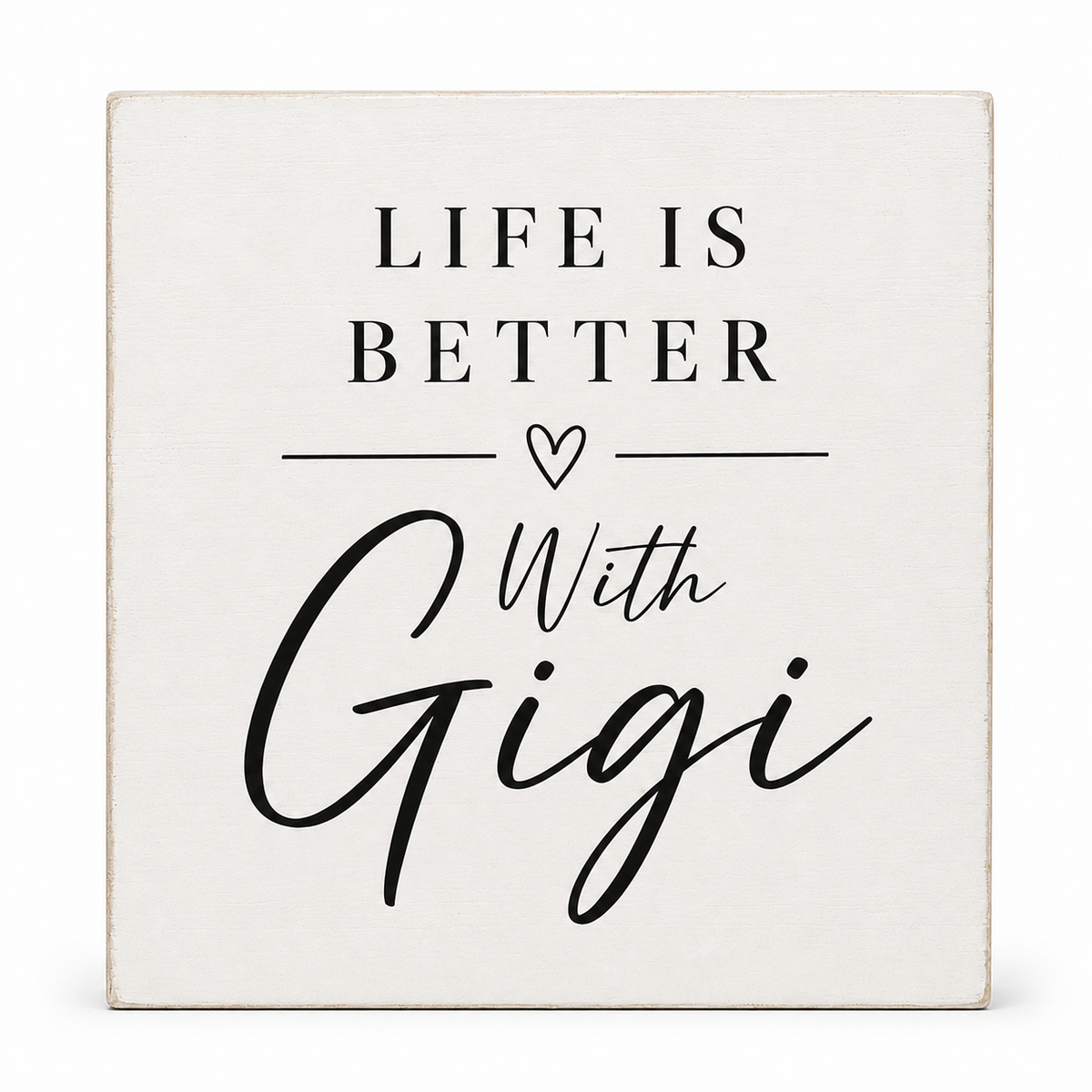 A square decorative sign with a distressed off-white background and black text reading 'LIFE IS BETTER With Gigi' and a small heart symbol, shown on a clean white background.