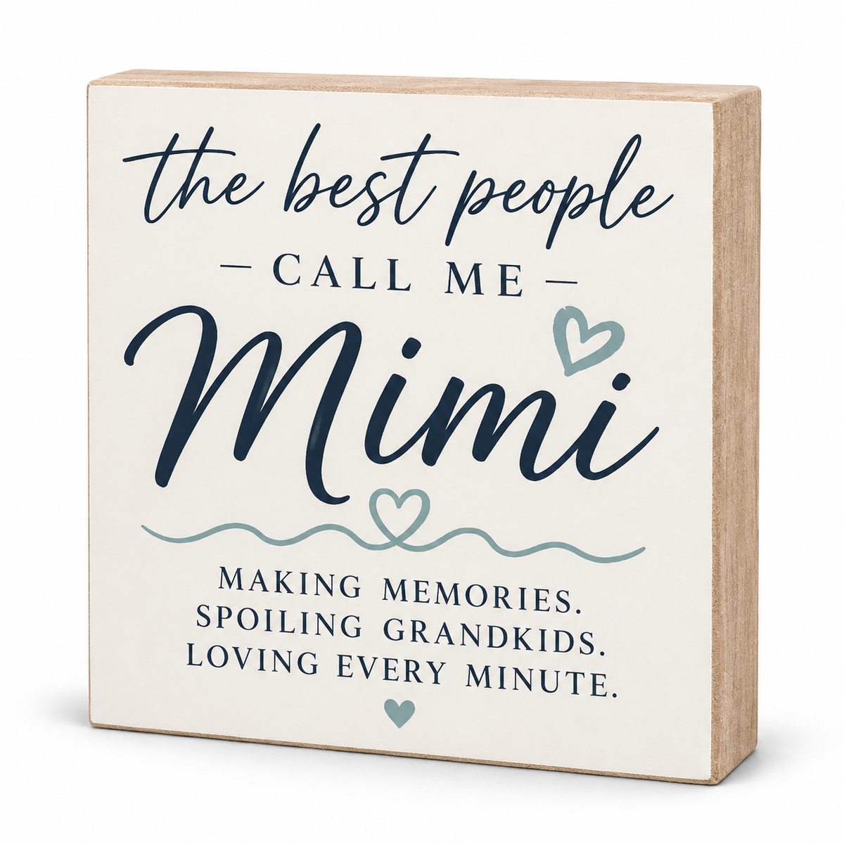 A square wooden sign with a cream face and natural wood sides, featuring the printed phrase 'the best people CALL ME Mimi' in dark navy script and block lettering, with small light blue heart and wave accents, plus additional text below.