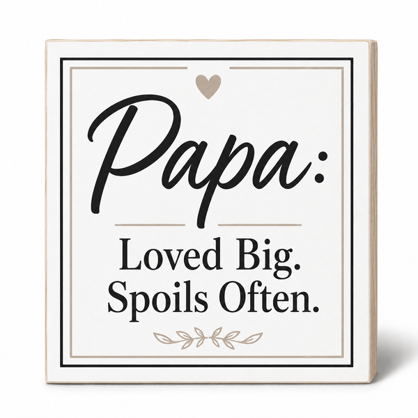 A square decorative sign with a light wood border and an off-white face. The sign reads 'Papa: Loved Big.