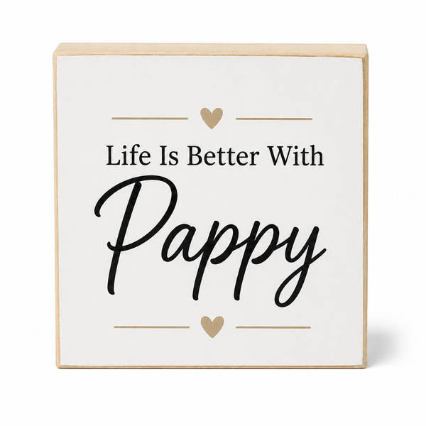A square decorative wooden sign with a white face and natural wood edges, featuring the text 'Life Is Better With Pappy' in black lettering with small gold heart accents, shown on a clean white background.