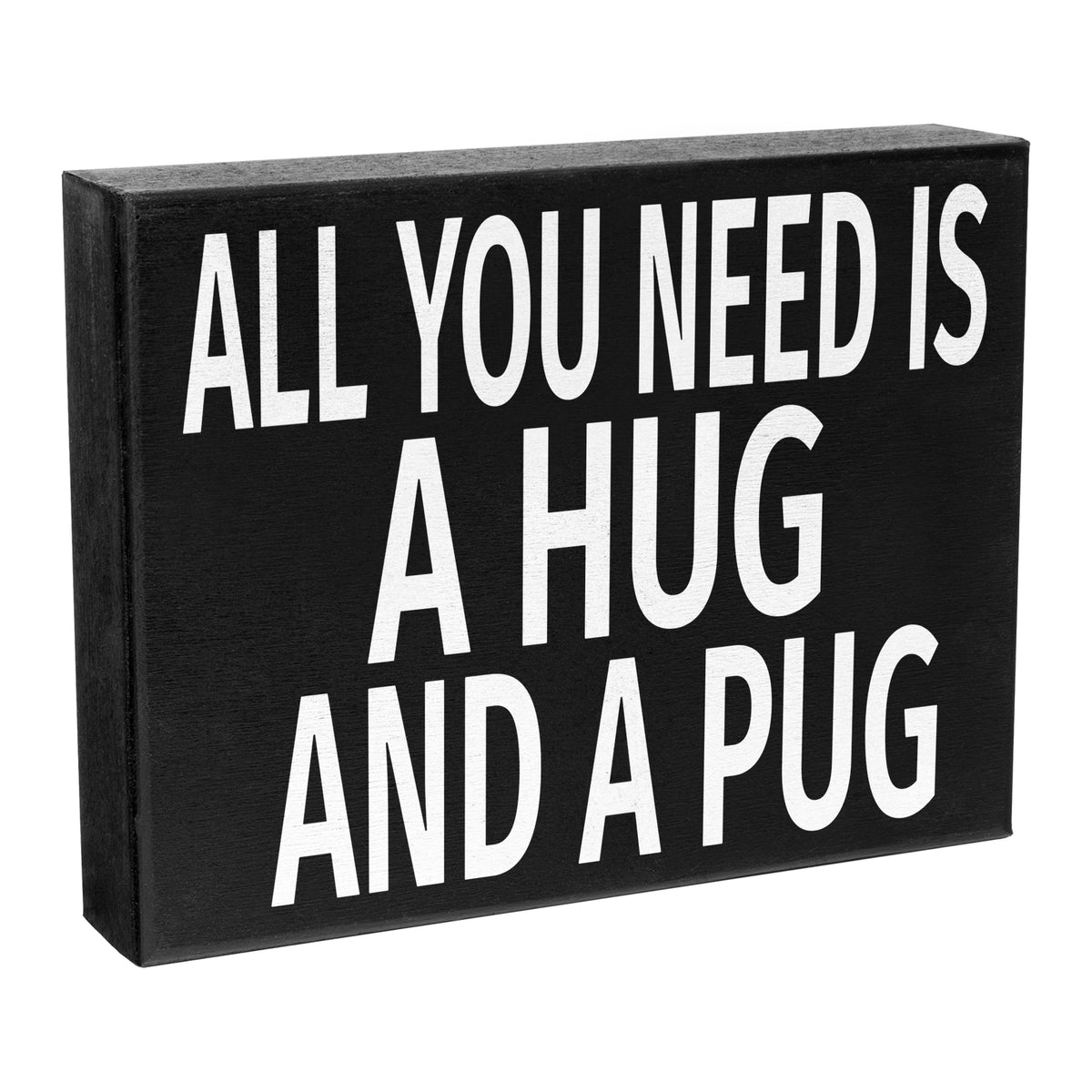 A black wooden sign with the text 'All You Need Is A Hug And A Pug' in white capital letters.