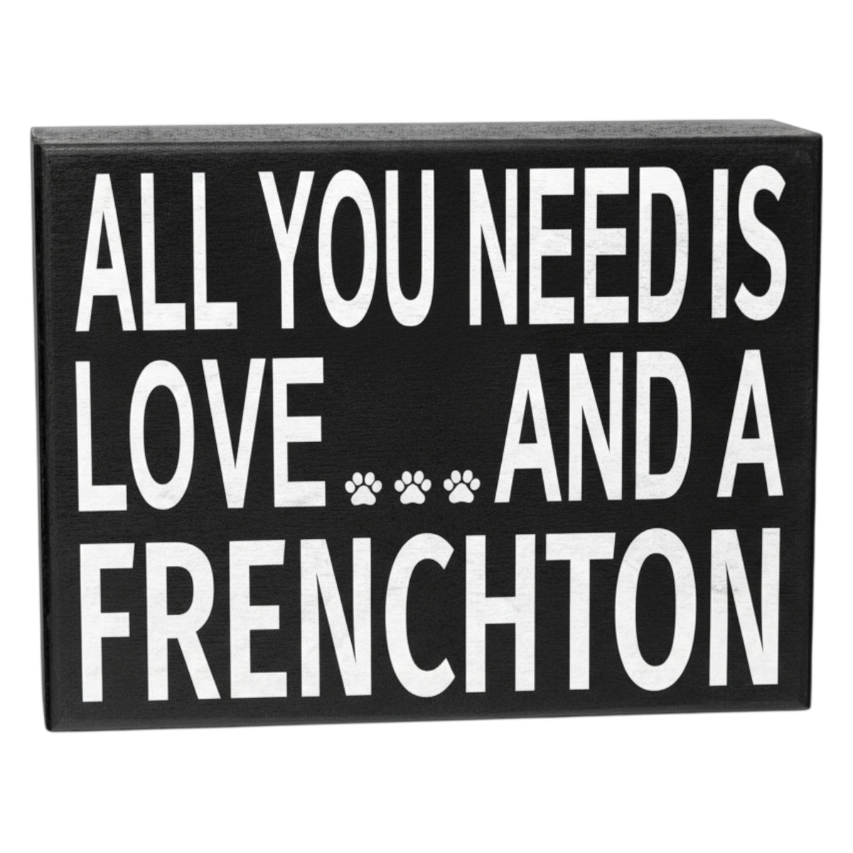 Black sign with white text 'All you need is love... and a Frenchtion' on a white background