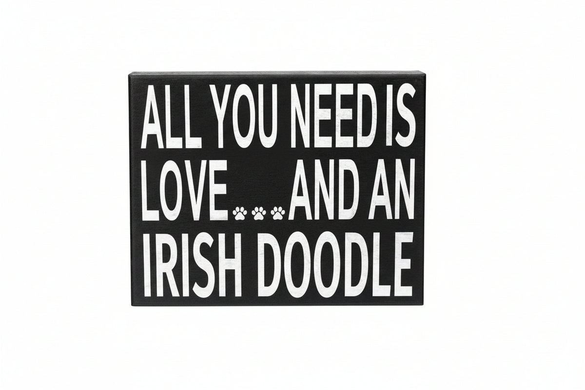 Decorative sign with text 'All you need is love and an Irish Doodle' on a white background