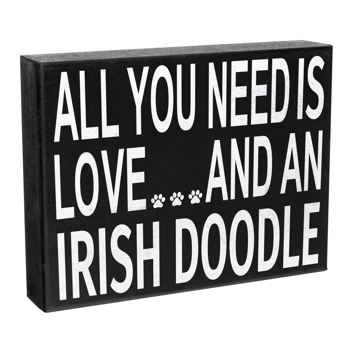 Decorative sign with text 'All you need is love... and an Irish Doodle' on a black background