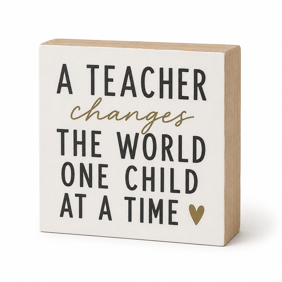 A square decorative wooden sign with a cream face and natural wood sides, featuring the text 'A TEACHER changes THE WORLD ONE CHILD AT A TIME' in black and gold lettering, with a small gold heart at the bottom right.