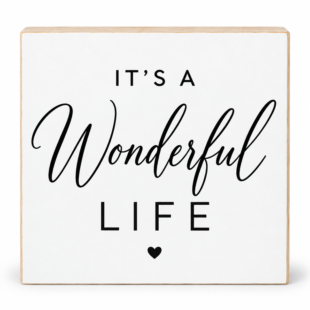 A square white decorative sign with a light natural wood border and black text that reads “IT’S A Wonderful LIFE” with a small heart below, shown on a clean white background.