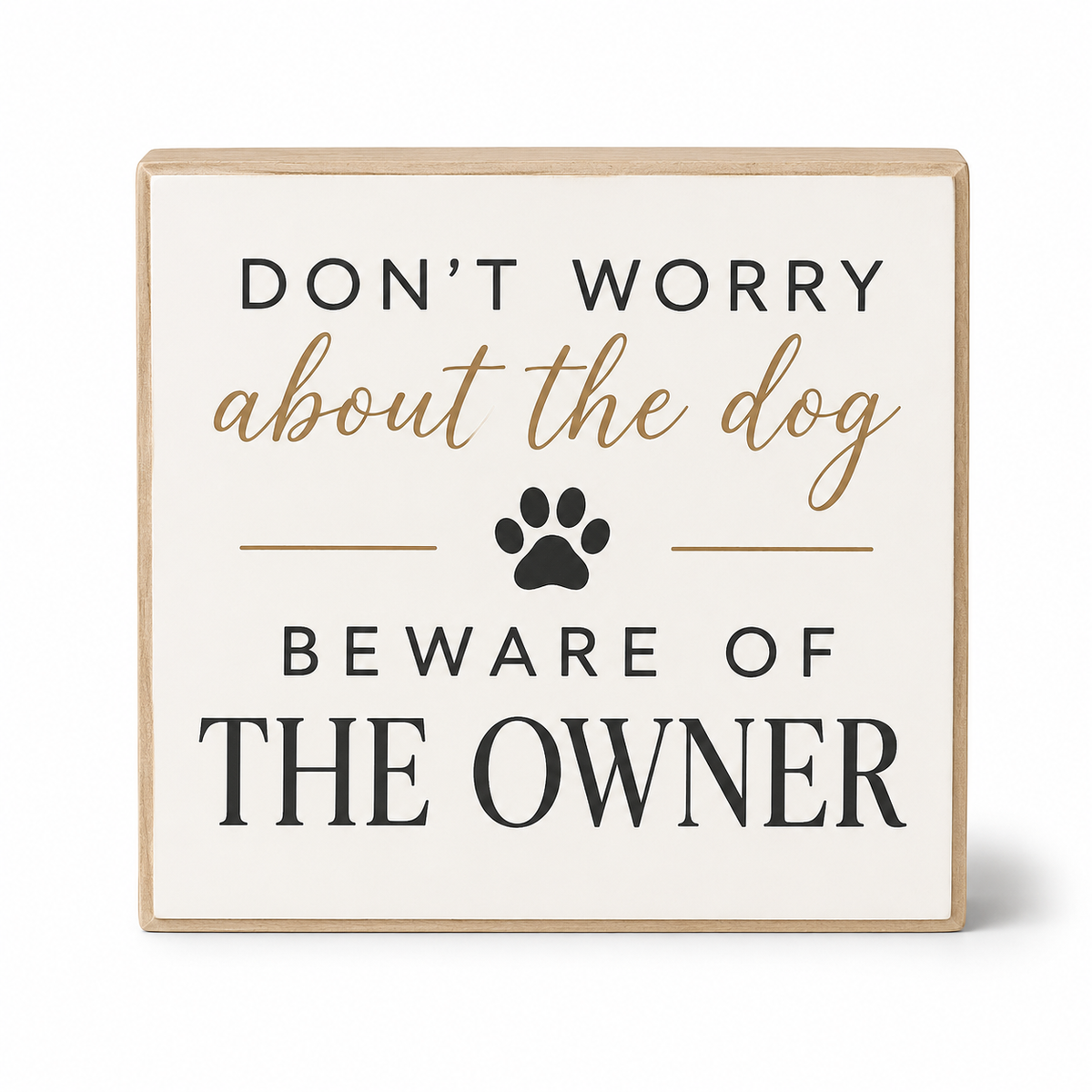 Square decorative wall sign with a light wood border and an off-white face. The sign reads “DON’T WORRY about the dog BEWARE OF THE OWNER” in black and tan lettering, with a black paw print in the center, on a white background.