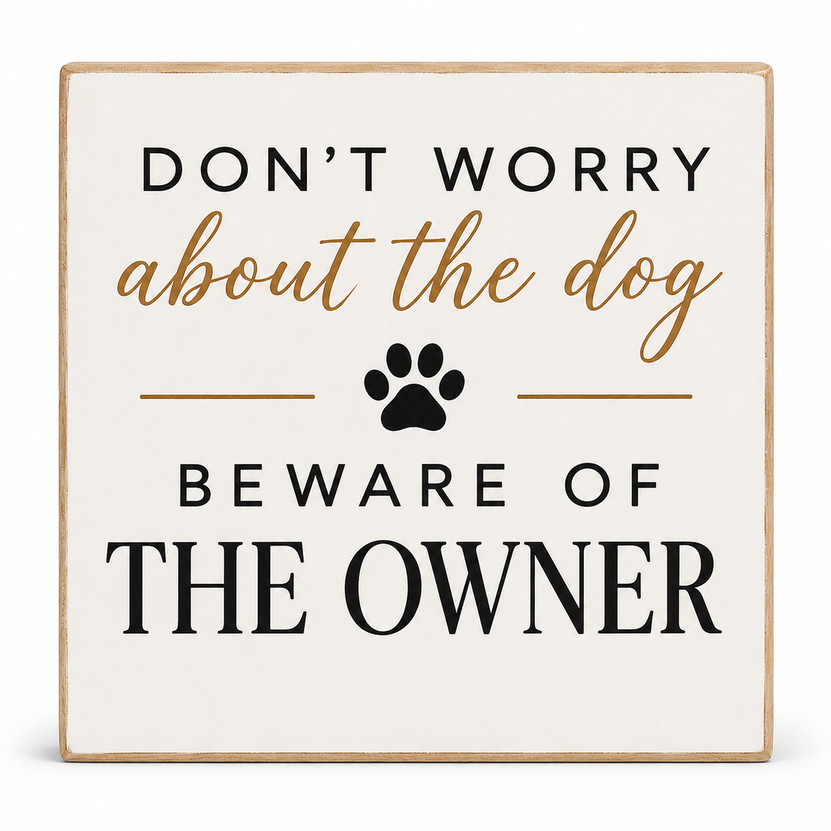 Square decorative sign with a light wood border and cream background. The sign reads “DON’T WORRY about the dog BEWARE OF THE OWNER” in black and tan lettering, with a black paw print in the center.