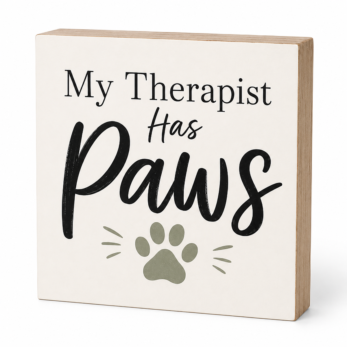 A square decorative wooden sign with a cream face and natural wood edges. The sign reads 'My Therapist Has Paws' in black lettering, with a muted sage green paw print and whisker graphic below.