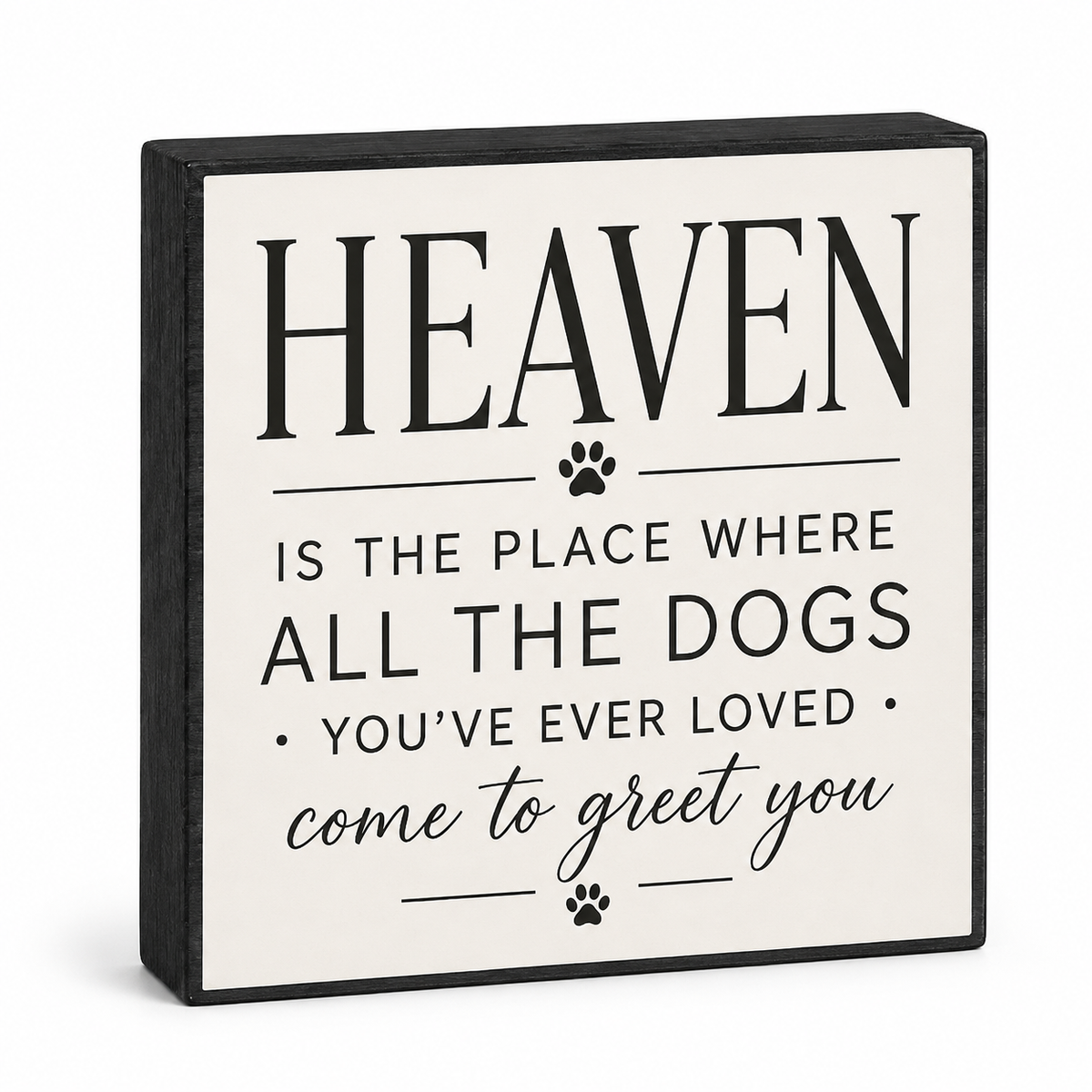 A square decorative wall sign with a black border and black text reading 'HEAVEN IS THE PLACE WHERE ALL THE DOGS YOU'VE EVER LOVED come to greet you,' plus small paw prints, shown on a white background.