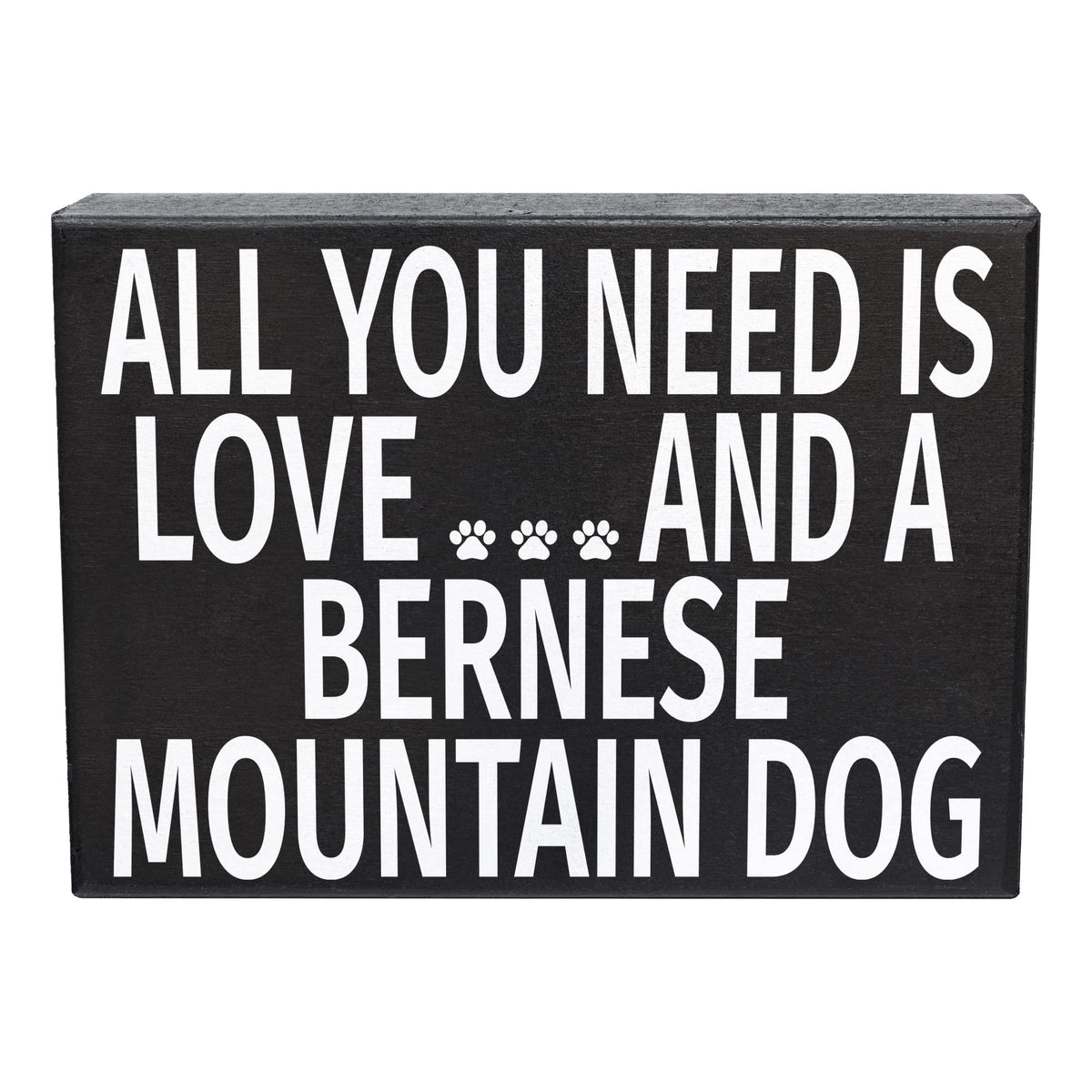 Black wooden sign with white text 'All you need is love and a Bernese Mountain Dog'