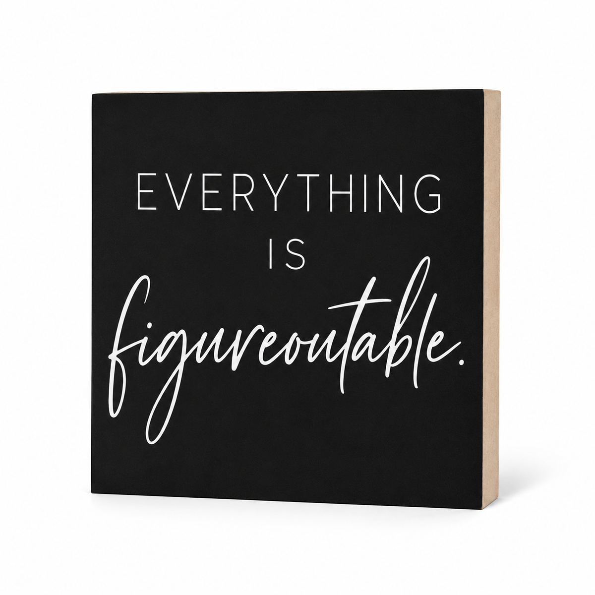 A square black decorative sign with a light wood side edge, featuring the phrase 'EVERYTHING IS figureoutable.' in white lettering, shown on a clean white background.