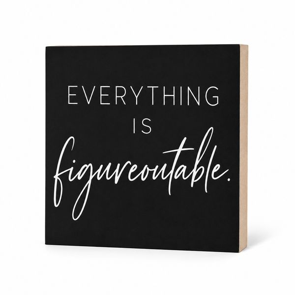 A square black decorative sign with a light wood side edge, featuring the phrase 'EVERYTHING IS figureoutable.' in white lettering, shown on a clean white background.
