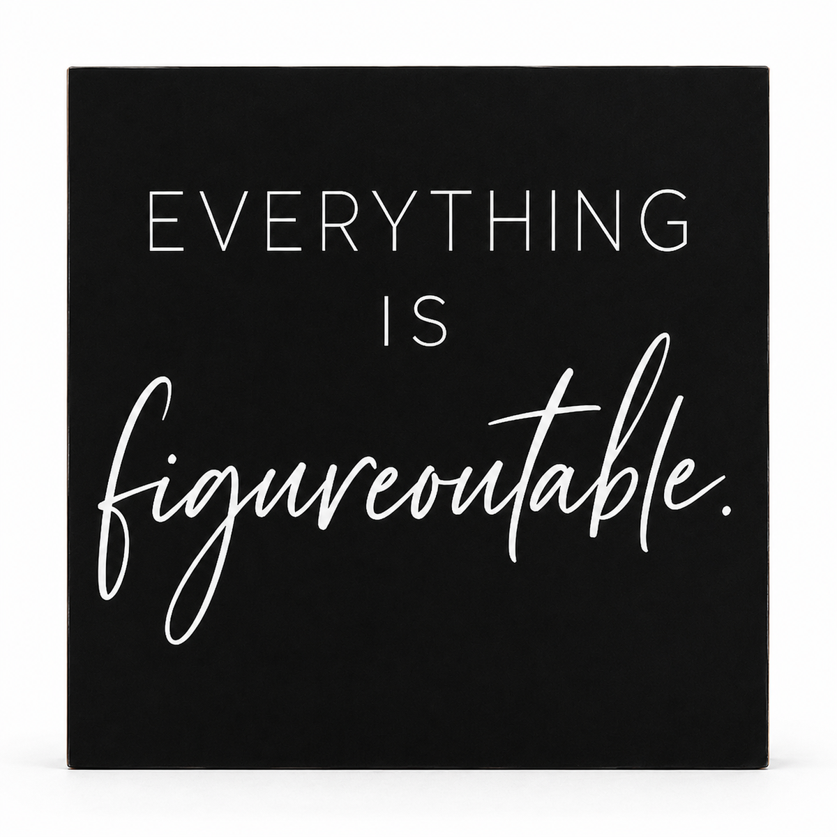 A square black decorative sign with white text reading 'EVERYTHING IS figureoutable.' on a clean white background.