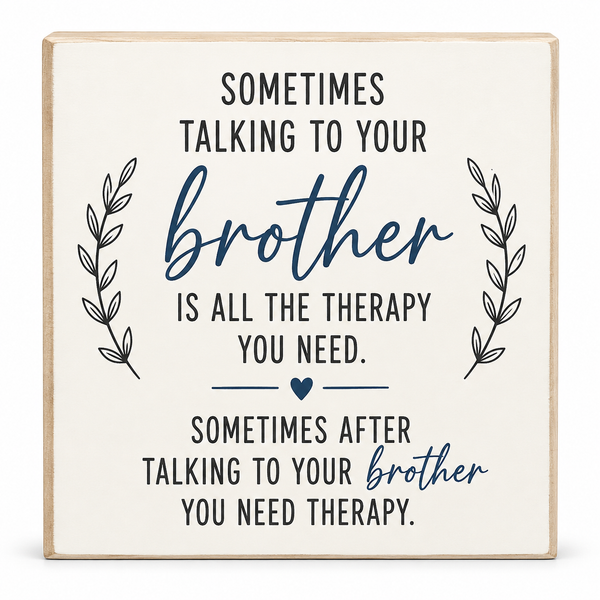 A square decorative wooden sign with a light natural wood border and an off-white face, printed with a humorous therapy quote about talking to your brother in black and navy text, flanked by black leafy sprigs and a small navy heart.