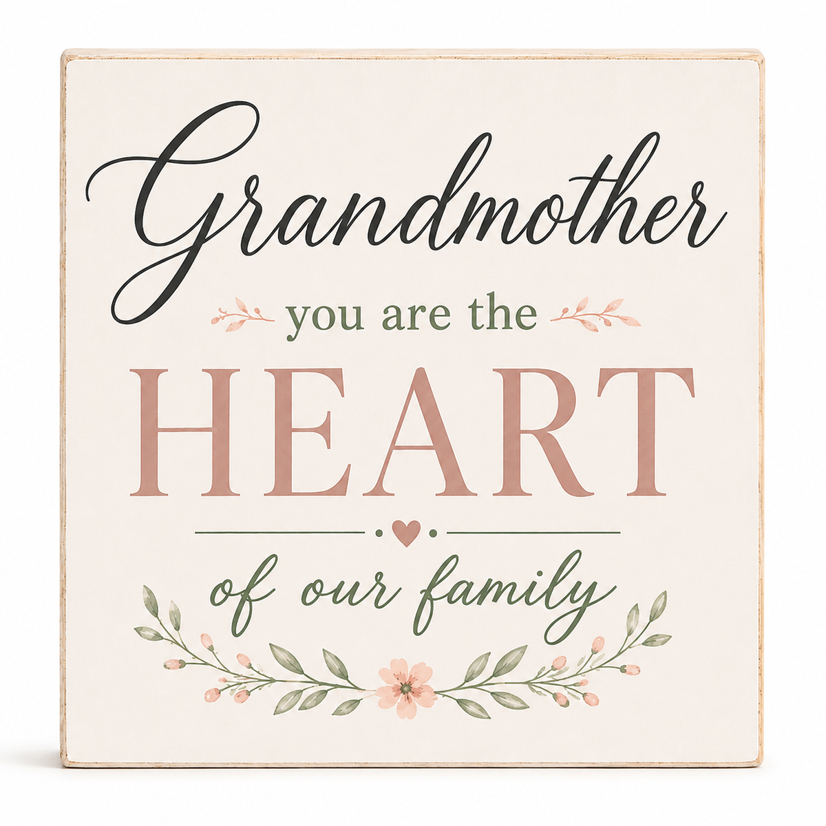 A square decorative sign with a cream background and distressed wood edges, featuring the phrase 'Grandmother you are the HEART of our family' in black and dusty pink lettering, with small floral and leaf illustrations.