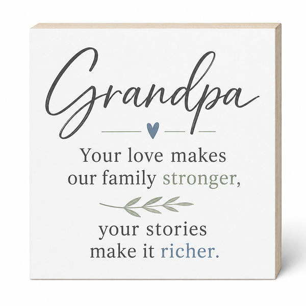 A square decorative sign with a white face and light wood edges, printed with the word 'Grandpa' in large script and a family quote in dark gray, muted green, and blue text, shown on a clean white background.